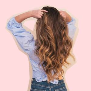 Woman holding her curly hair