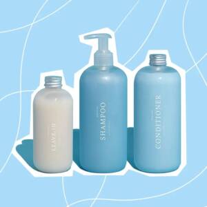 How to take care of curly hair: bottles of shampoo, conditioner, and a leave-in conditioner