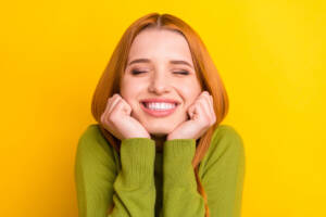Red hair color ideas: happy woman with red hair